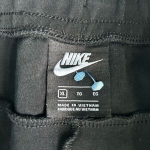 Black Nike tech pants